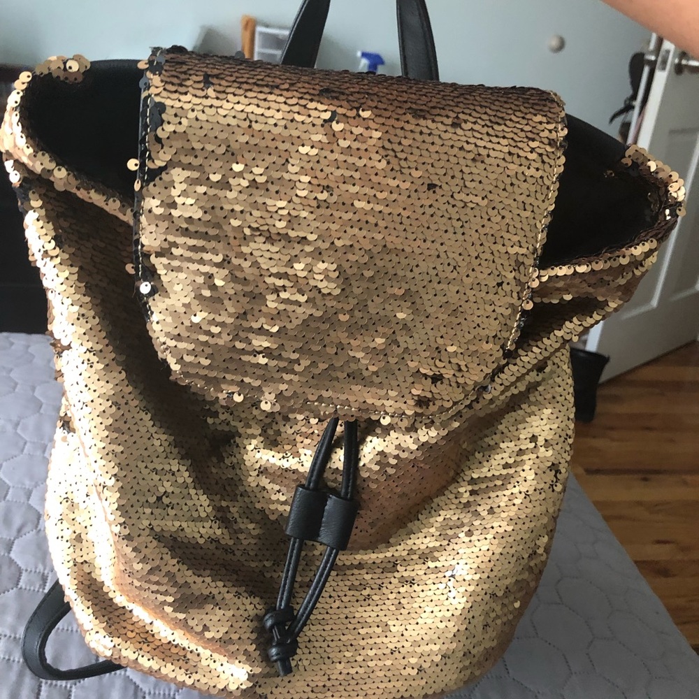 Gold and black sequent backpack